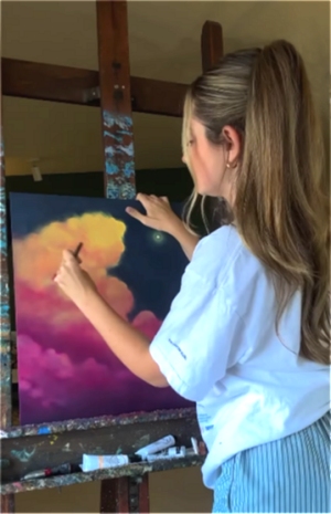 Lauryn Squyres painting in the studio